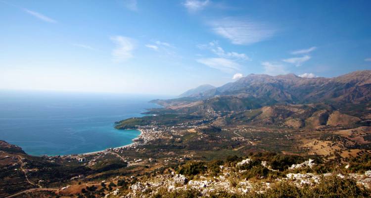 Coastal landscape with mountains and sea.