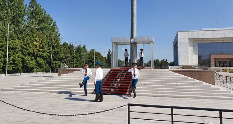 Guards performing ceremonial duties at a monument.