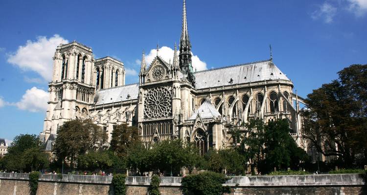 Notre Dame Cathedral with its intricate design and a clear sky.