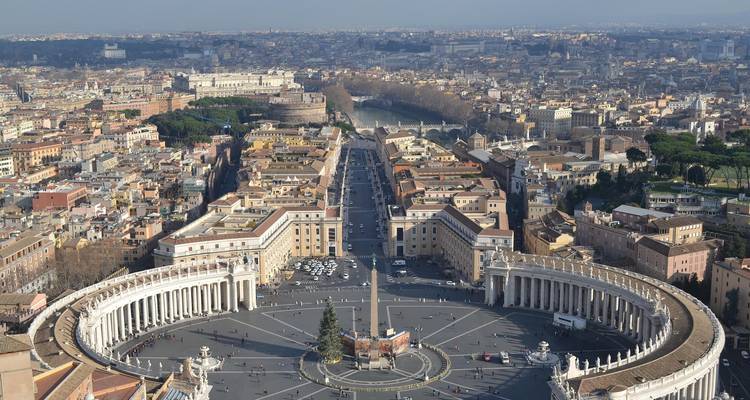 Aerial view of St. Peter's Square with surrounding cityscape.