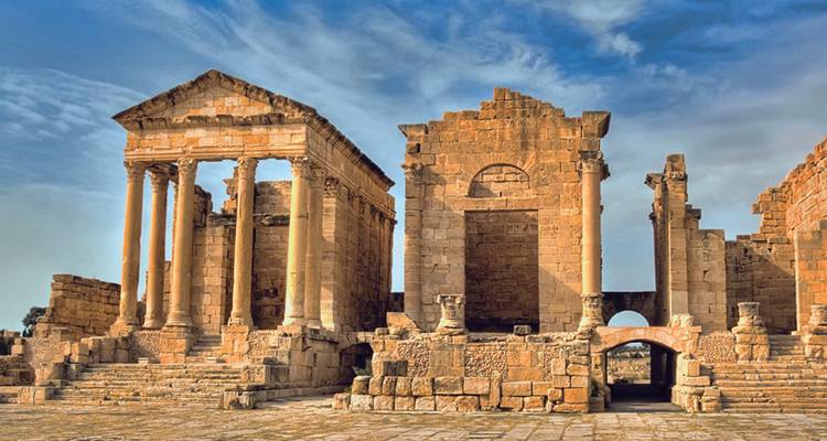 Ancient Roman ruins featuring a large temple.