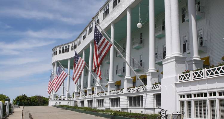 Large hotel building decorated with American flags.