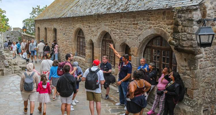 A group tour within the historic walls of Mont Saint-Michel.