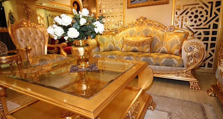 Luxurious interior with golden decor and furniture.