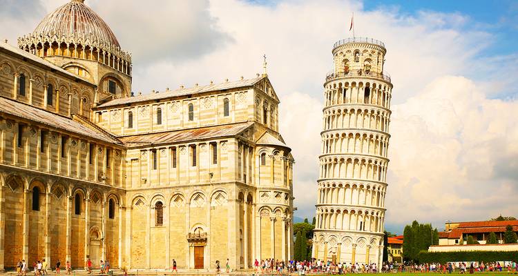 Famous leaning tower and cathedral in a city square.