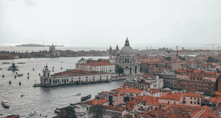 Aerial view of Venice showing canals and historical buildings.