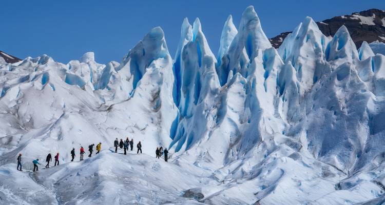 People walking on a glacier.