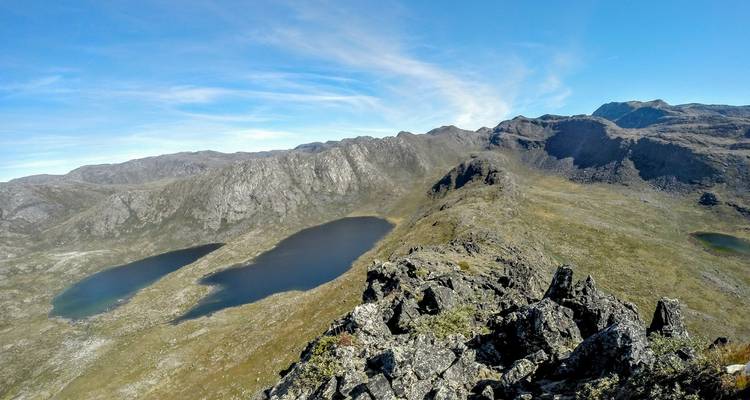 Aerial view of a mountainous landscape with several lakes.