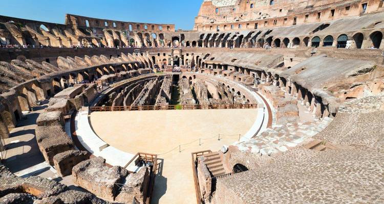Interior view of the Colosseum in Rome, with a clear view of the arena.