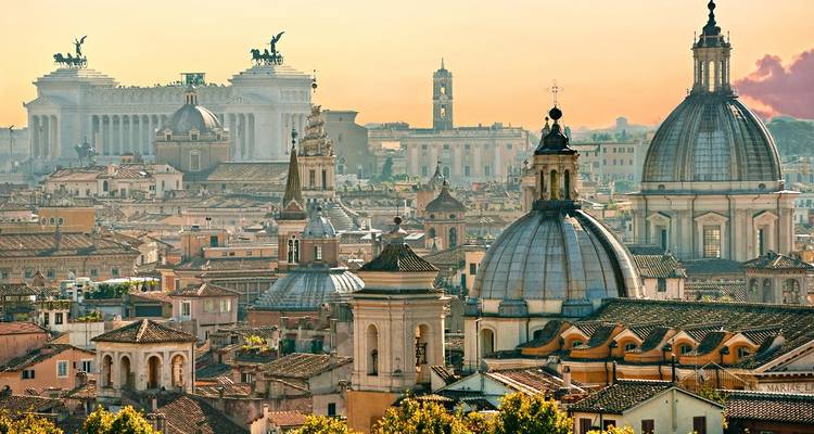 Panoramic view of Rome's skyline with historic buildings and monuments.