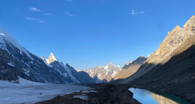 Scenic view of snow-covered mountains and a lake.
