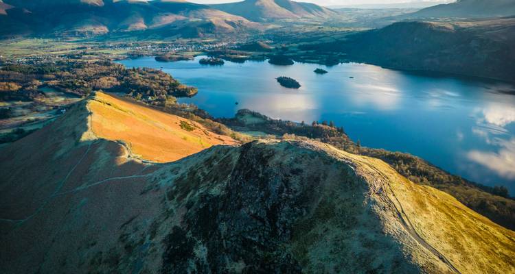 Aerial view of mountains and a lake.