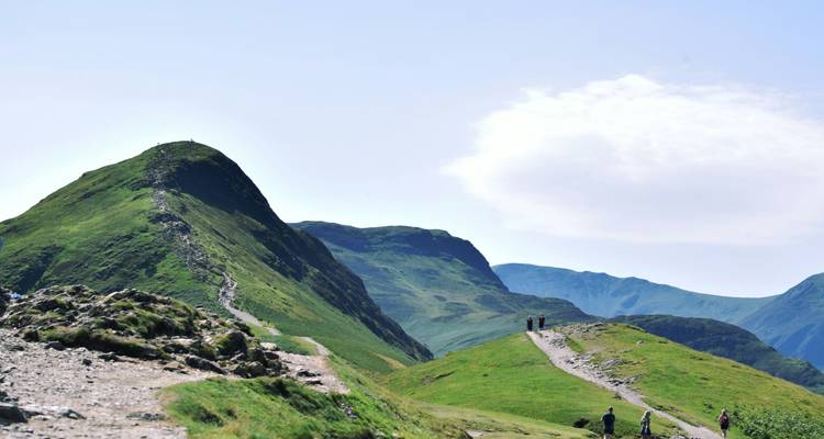 Hikers on a mountainous trail.