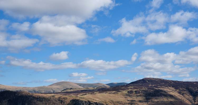 Skyline view of hills under a blue sky.