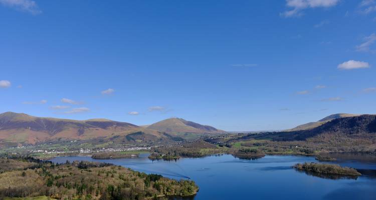 Aerial view of a lake surrounded by hills.