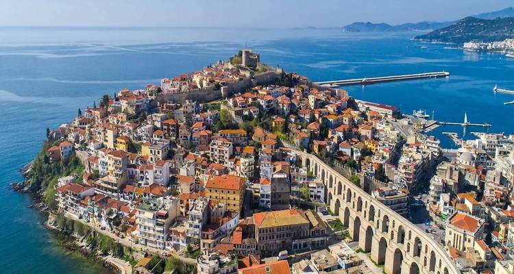 Aerial view of a coastal city with an old fortification.