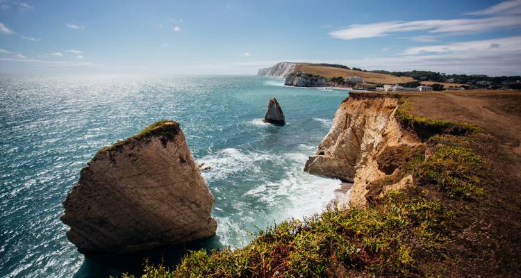 Cliffs and sea with a clear view of rock formations.