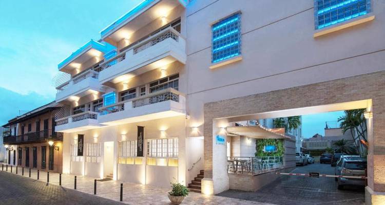 Modern hotel facade with illuminated blue accents.