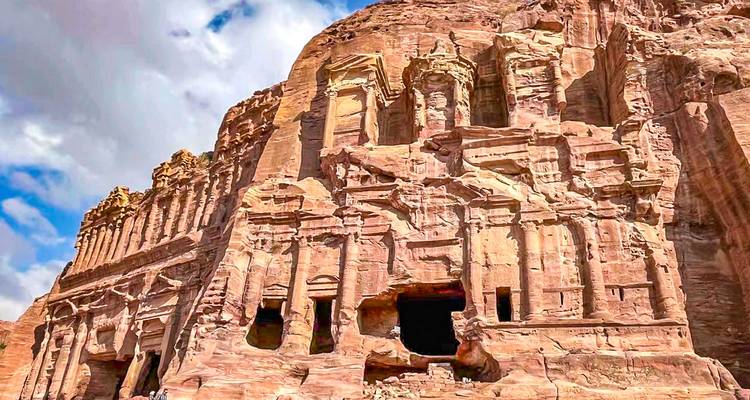 Rock-cut architecture of Petra with intricate carvings on the facade.
