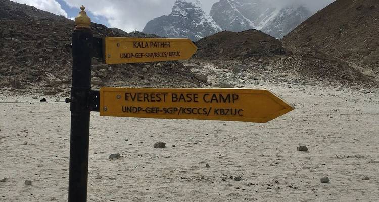 Signpost pointing towards Everest Base Camp and Kala Patthar.