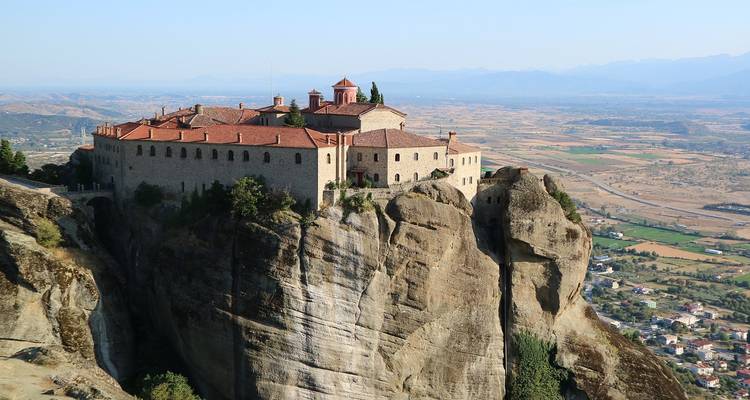Monastery on a rock cliff with panoramic views.