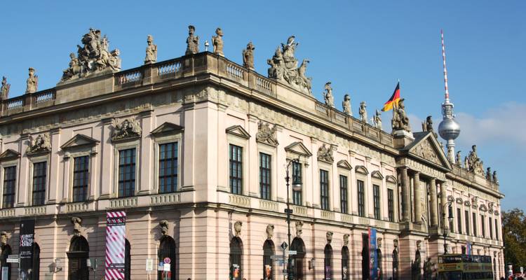 A historic building with a television tower in the background in Berlin.