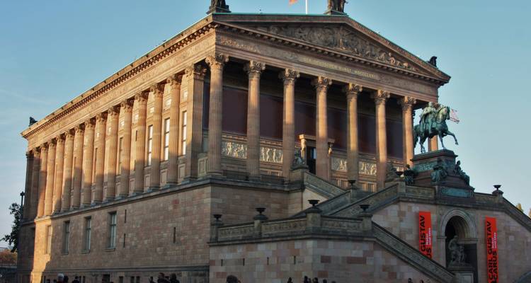 A museum building with a statue of a horseman.