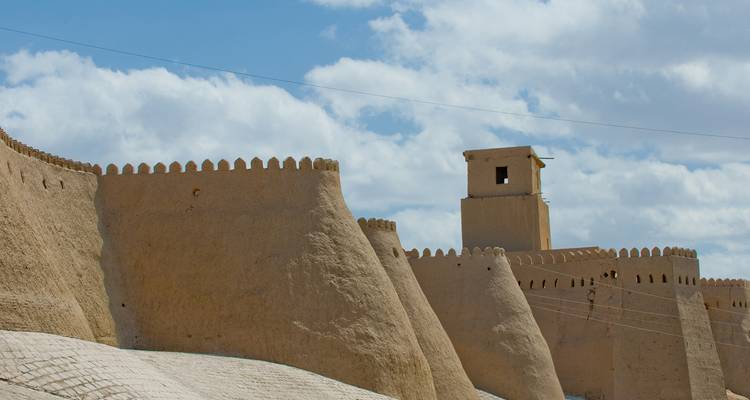 Walls of an ancient fortress under a bright sky.