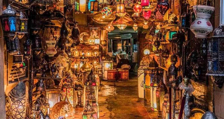 Interior of a market with various lanterns.