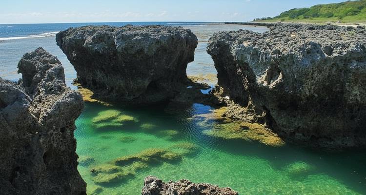 Rocky coastal area with clear blue-green water.