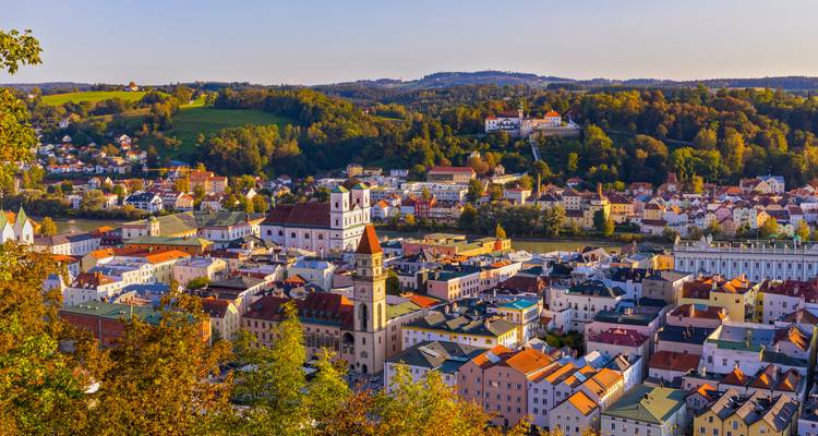 Sun-lit panorama of Passau’s colorful old town at the confluence of rivers.