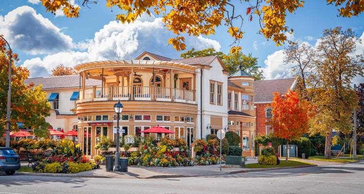 Charming heritage town center with autumn foliage, colorful façades, outdoor cafés and abundant flowers.