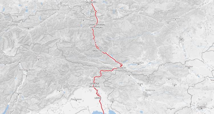 A detailed route map showing a red line from Salzburg through the Alps to Udine and the Adriatic coast.