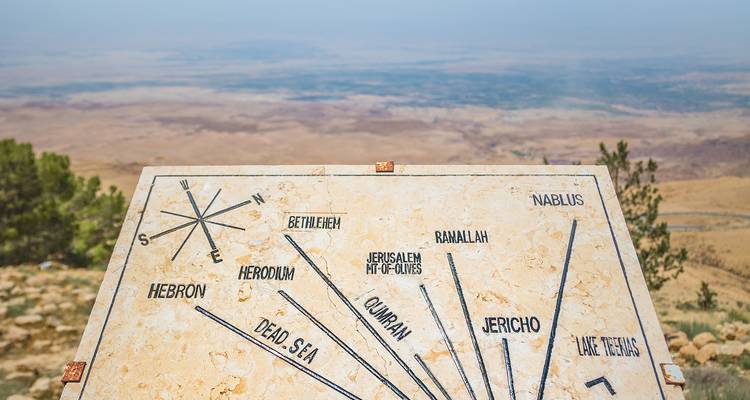View from Mount Nebo with a direction sign pointing to various landmarks.