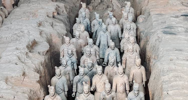 Rows of life-size Terracotta Warriors stand in excavated pits in Xi'an.