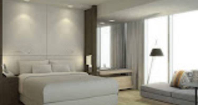 Low-resolution blurry photo of generic modern hotel room.