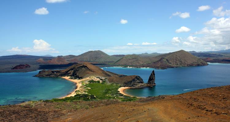 Classic panoramic vista of Bartolomé Island’s Pinnacle Rock and surrounding turquoise bays.