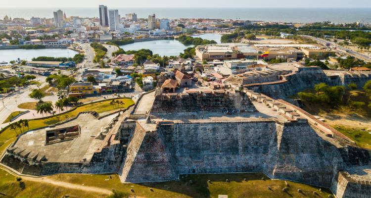 Drone view of massive stone walls of Castillo San Felipe de Barajas overlooking Cartagena.