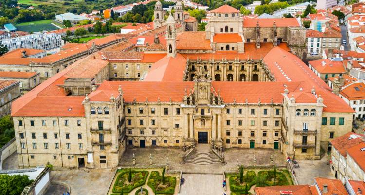 Bird's-eye view of the historic Monastery of San Martiño Pinario with symmetrical courtyards in Santiago.