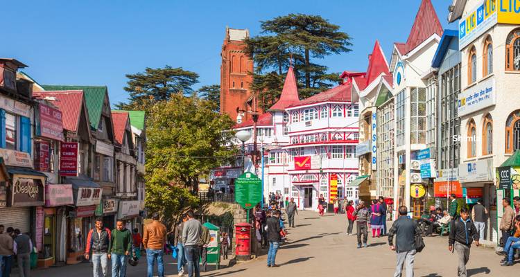 Pedestrian Mall Road in Shimla lined with colourful colonial buildings bustling with locals and visitors.