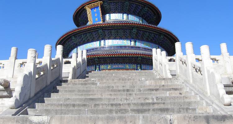 Temple of Heaven’s Hall of Prayer rising above marble stairway under clear sky.