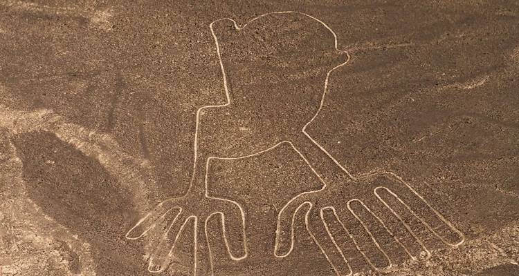 Aerial view of the Nazca Lines ‘Hands’ geoglyph etched into the desert plain