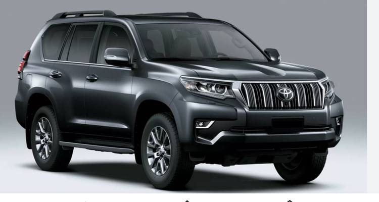 Studio profile of a dark grey Toyota SUV presented on a light background.