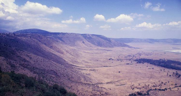 Vast panoramic view over the Ngorongoro Crater’s steep rim and flat floor