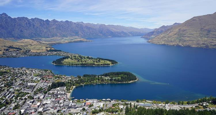 Aerial panorama of Queenstown, Lake Wakatipu and surrounding peaks.