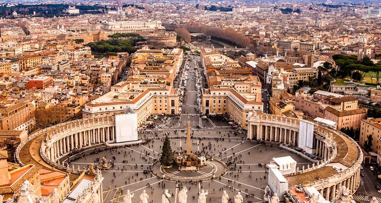 Aerial view of St. Peter’s Square and the cityscape of Rome spreading beyond.