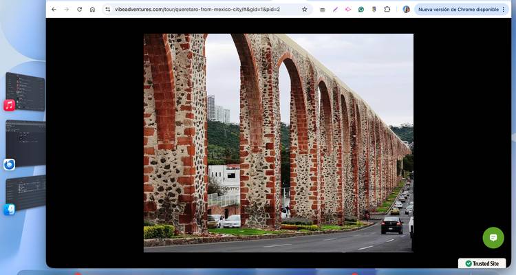 Screenshot of an arched colonial aqueduct spanning a city avenue, displayed within a web browser window.