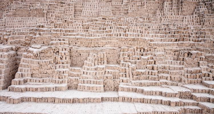 Close-up texture of stepped adobe bricks from an ancient pre-Inca pyramid.