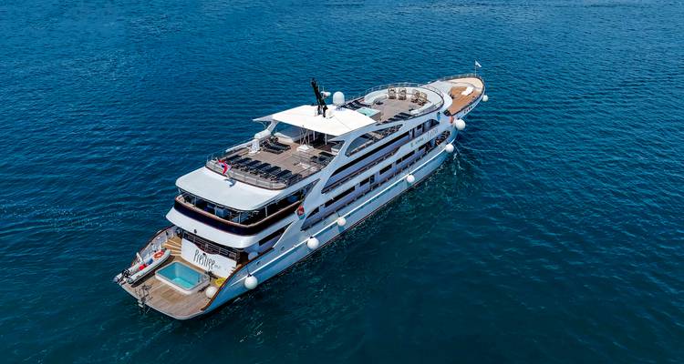 Drone shot of luxury yacht cruising open Adriatic waters.