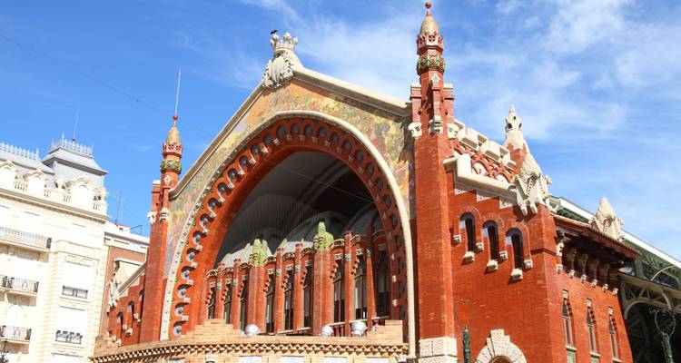 Colorful Modernista Mercado de Colón building with ornate brick and ceramic façade in Valencia